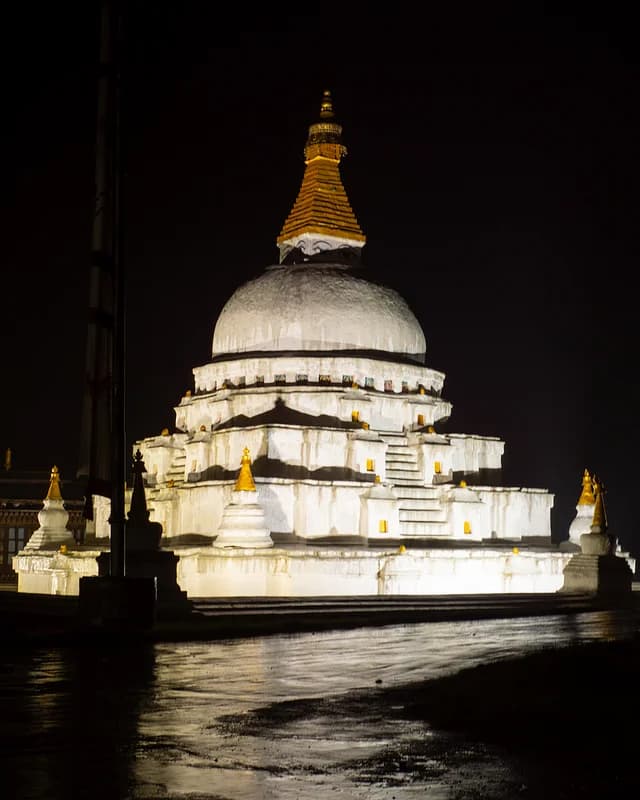 Chorten Kora illuminated at night in Trashiyangtse