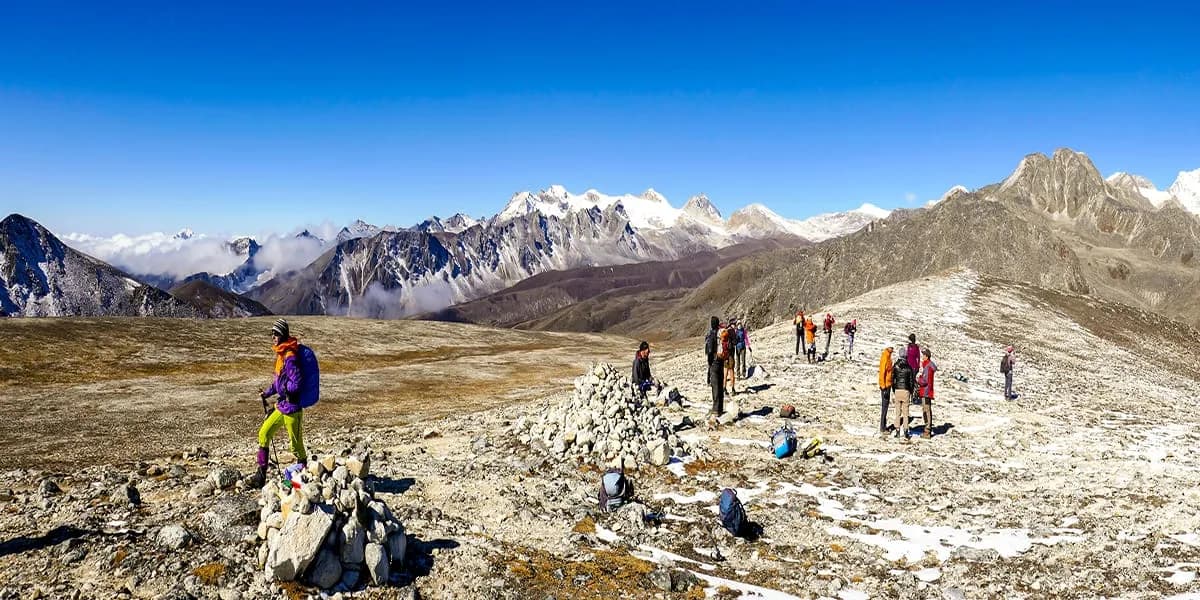Trekkers crossing a highland ridge in Bhutan